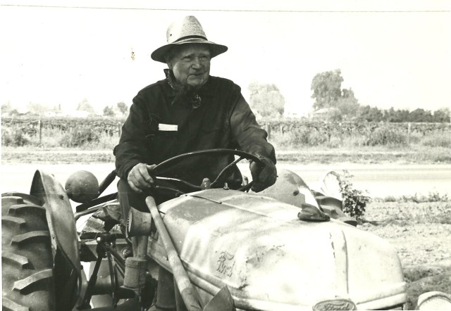 Taken Close to his 80th Birthday, gramps often drove his Ford Tractor into town. Mom Bette, earlier bought him a dog, he ate the tractor seat among other items Gramps called the dog," Boucher"